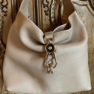 Dooley & Bourke Logo Lock Sack Purse. NWOT. Tan Pebble Grain Leather.